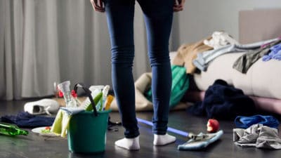 Woman horrified by mess left after party in her apartment, cleaning service, stock footage